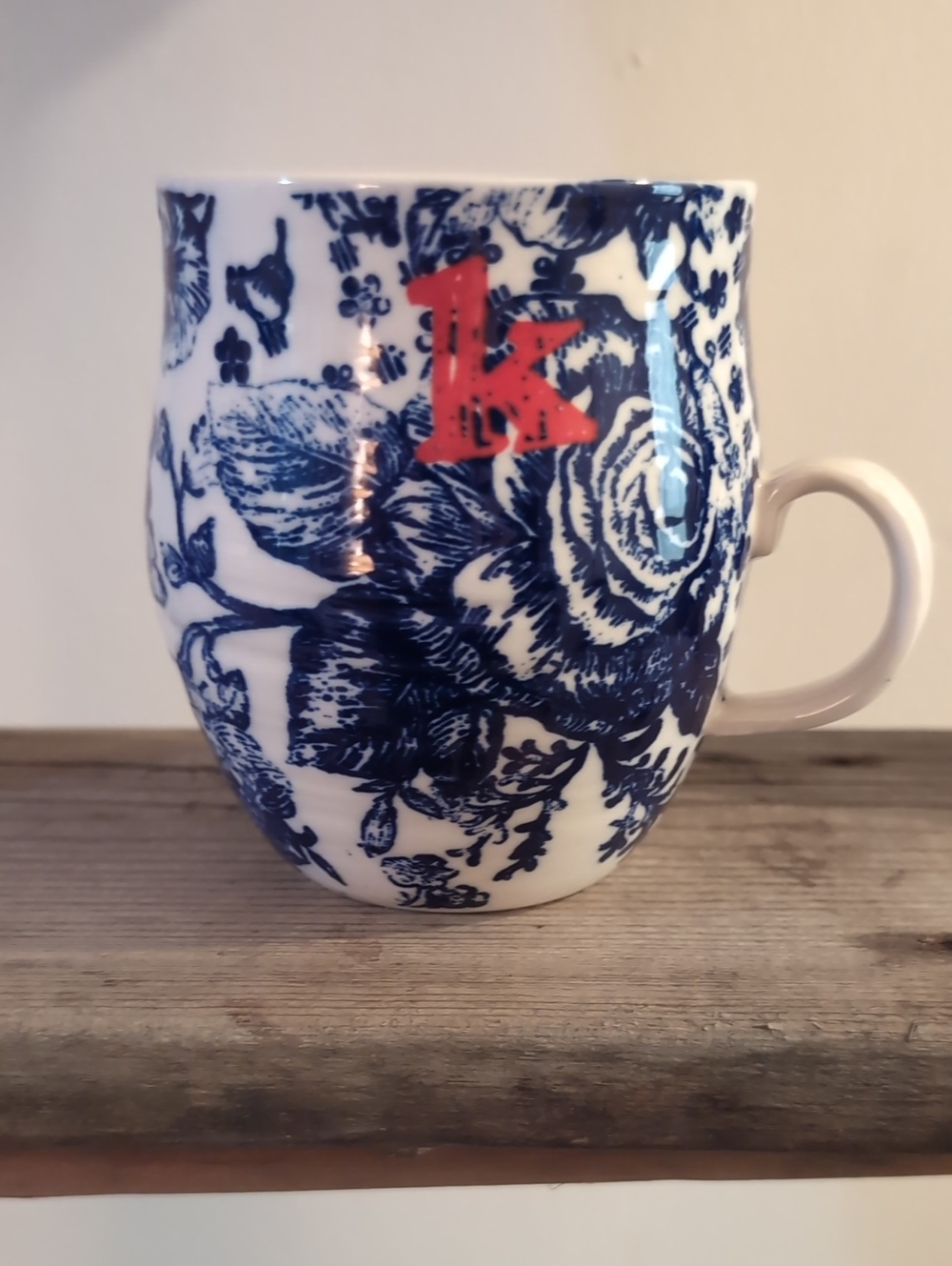 Anthropologie White Mug with Navy Floral and Red Accent